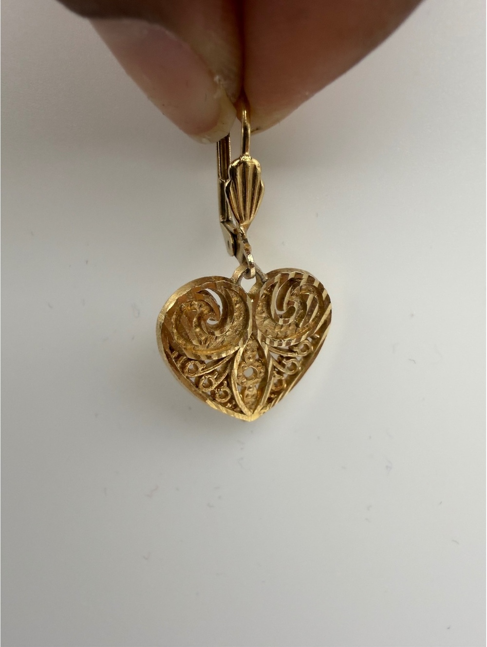 Gold tone heart dangle earring